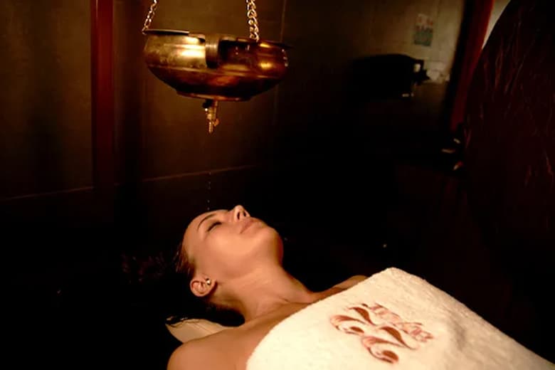 Takradhara medicated buttermilk stream treatment at 22 Ayur