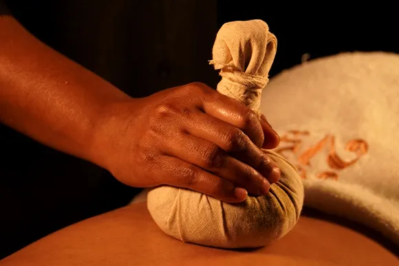 Sweda with Kizhi herbal poultice treatment at 22 Ayur